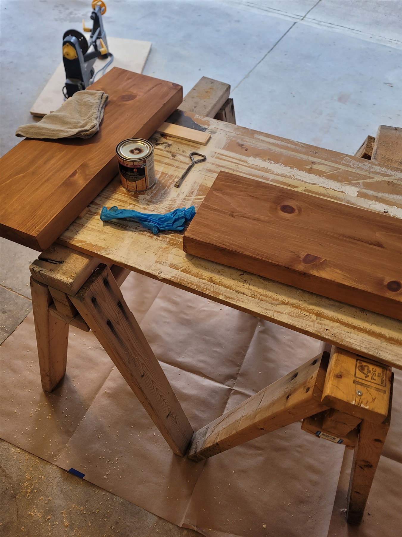 The pair of floating shelves being stained in Keith’s workshop