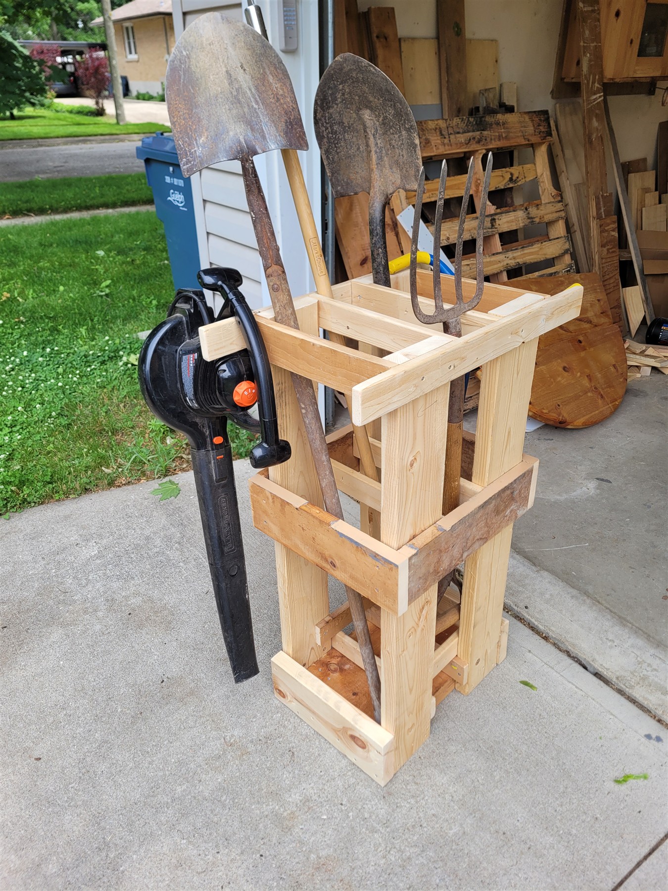 Full view of the Guelph Tool Library caddy loaded with long-handled garden tools